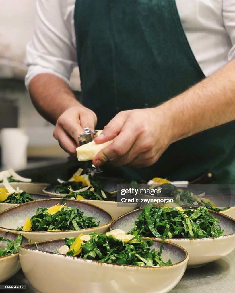 Chef cooking in the industrial kitchen