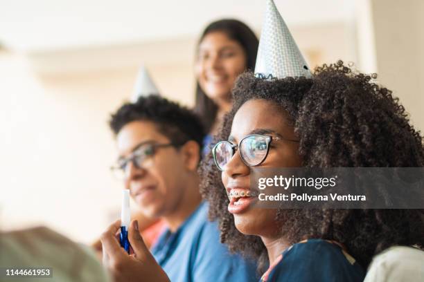 young people having fun at birthday party - blue braces stock pictures, royalty-free photos & images