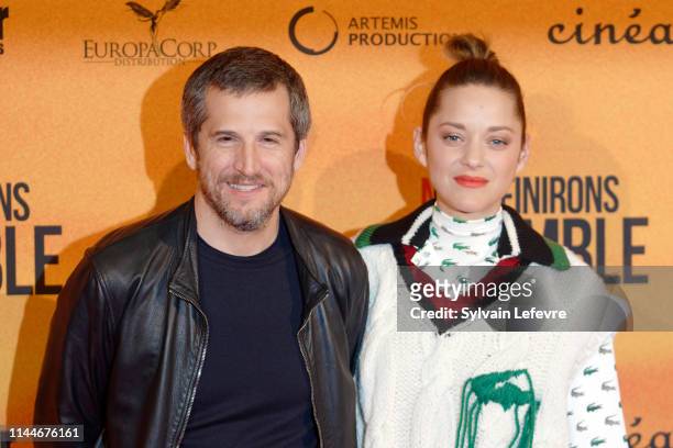 Actress Marion Cotillard and her husband and film director Guillaume Canet attend the "Nous finirons Ensemble" photocall premiere at UGC De Brouckere...