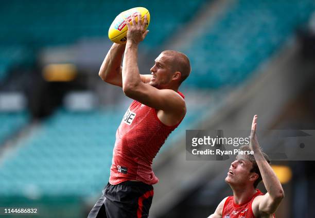 Sam Reid of the Swans marks over Nick Blakey of the Swans during a Sydney Swans AFL training session at the Sydney Cricket Ground on April 24, 2019...