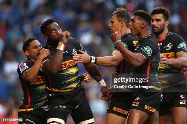 Stormers captain Siya Kolisi celebrates with teammates after scoring the opening try during the Super Rugby match between DHL Stormers and Crusaders...