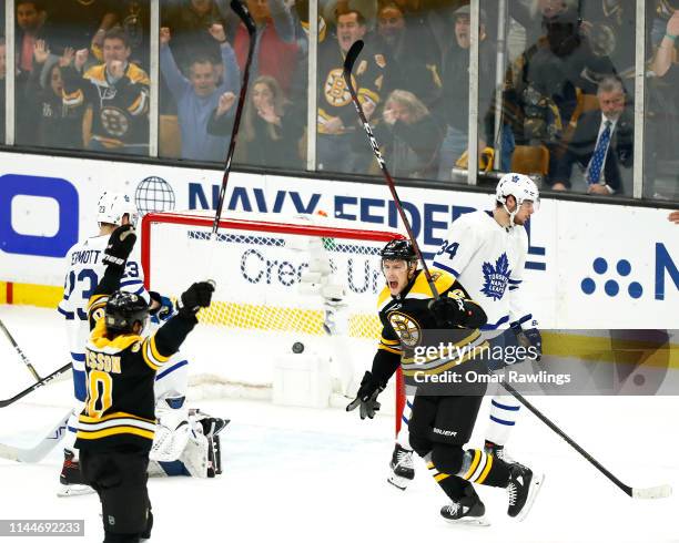 Charlie Coyle and Marcus Johansson of the Boston Bruins celebrate their goal against the Toronto Maple Leafs in the first period of Game Seven of the...