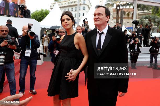 Film director Quentin Tarantino and his wife Israeli singer Daniella Pick pose as they arrive for the screening of the film "The Wild Goose Lake " at...