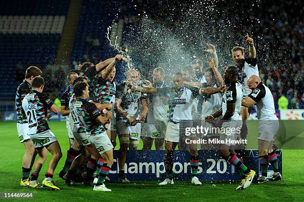 The Harlequins players celebrate victory with champagne at the end of the Amlin Challenge Cup Final match between Harlequins and Stade Francais at...