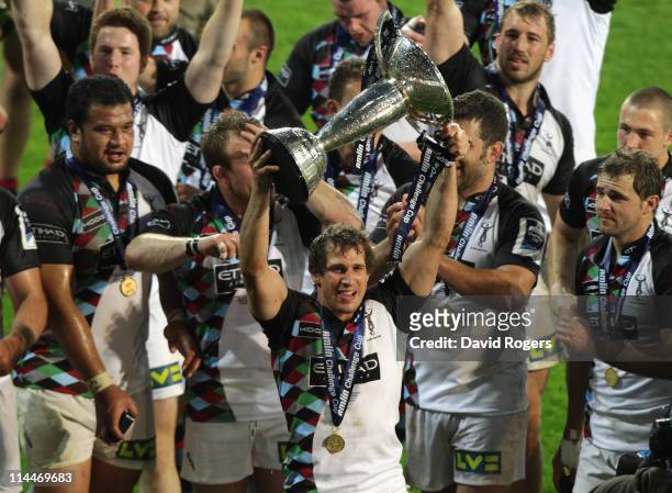 Gonzalo Camacho of Harlequins, who scored the last minute try, holds the trophy after his teams victory during the Amlin Cup final between Harlequins...
