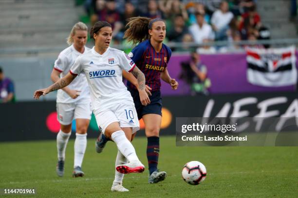 Dzsenifer Marozsan of Olympique Lyonnais passes the ball before Alexia Putellas of FC Barcelona during the UEFA Women's Champions League Final match...