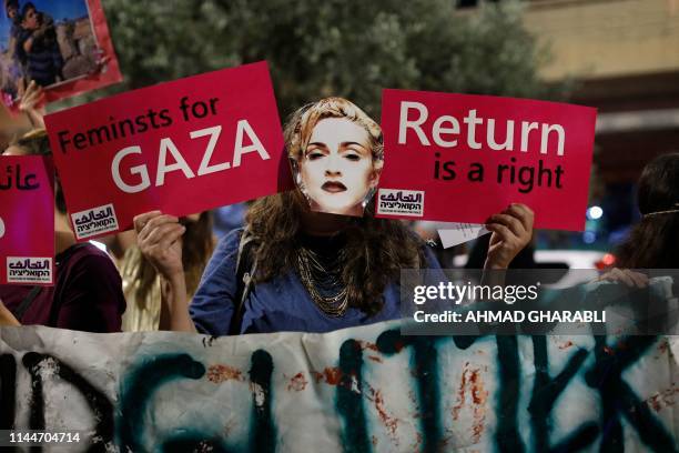 Demonstrator wearing a mask, bearing the likeness of American singer Madonna, during a protest calling for a boycott of the ongoing 2019 Eurovision...