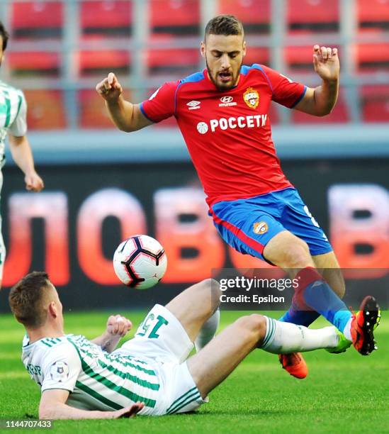 Nikola Vlasic of PFC CSKA Moscow and Andrei Semyonov of FC Akhmat Grozny vie for the ball during the Russian Football League match between PFC CSKA...