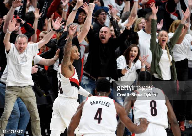 Damian Lillard of the Portland Trail Blazers reacts after hitting the game winning shot in Game Five of the Western Conference quarterfinals against...