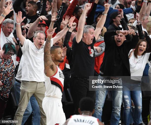 Damian Lillard of the Portland Trail Blazers reacts after hitting the game winning shot in Game Five of the Western Conference quarterfinals against...