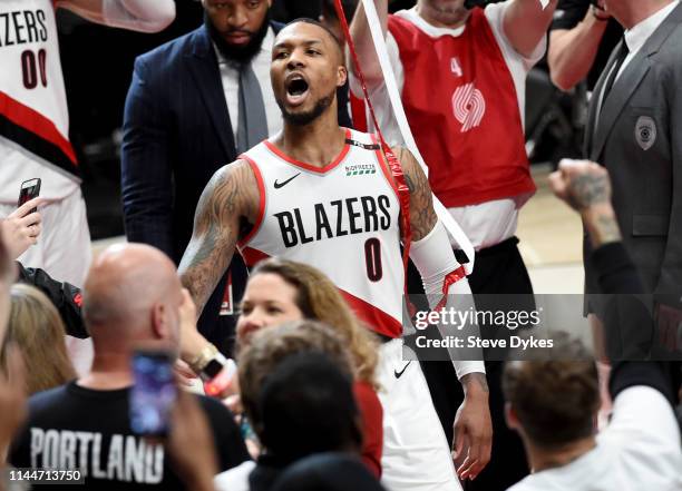 Damian Lillard of the Portland Trail Blazers reacts after hitting the game winning shot in Game Five of the Western Conference quarterfinals against...