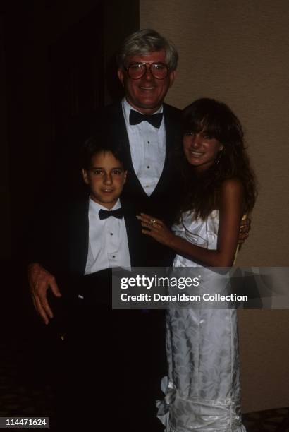 Host Phil Donahue and kids pose for a portrait in circa 1985 in Los Angeles, California.