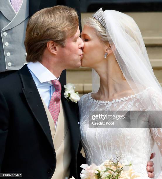 Thomas Kingston and Lady Gabriella Windsor kiss as they leave St George's Chapel following their wedding on May 18, 2019 in Windsor, England.