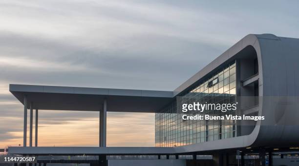 glass and concrete modern building. - milan airport stock pictures, royalty-free photos & images
