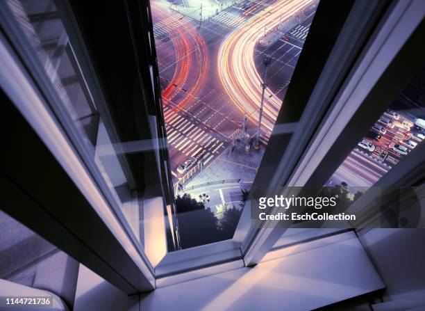 window view from office building of busy road junction - futuristic office stock-fotos und bilder