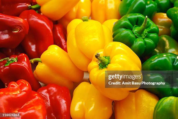 red, yellow and green bell peppers - peppar stock pictures, royalty-free photos & images