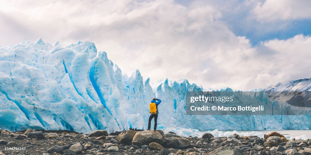 Tourist photographing the front of Perito Moreno glacier, Argentina