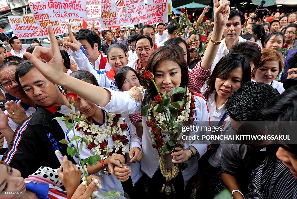 Yingluck Shinawatra (C), sister of fugit