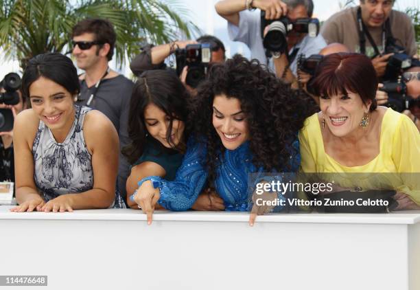 Actresses Hafsia Herzi, Leila Bekhti, Sabrina Ouazani and Biyouna attend the "La Source Des Femmes" Photocall at Palais des Festivals during 64th...