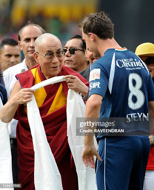 PACKAGETibetan Spiritual Leader The Dalai Lama greets South African cricketer Dale Steyn ahead of the IPL match Between Deccan Chargers and Kings XI...