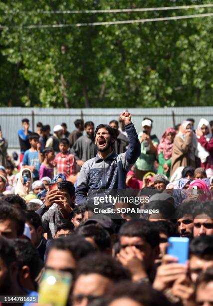Kashmiri villager seen shouting pro freedom slogans during the funeral ceremony of slain Kashmiri Rebel Showkat Ahmed at his residence in Pulwama,...