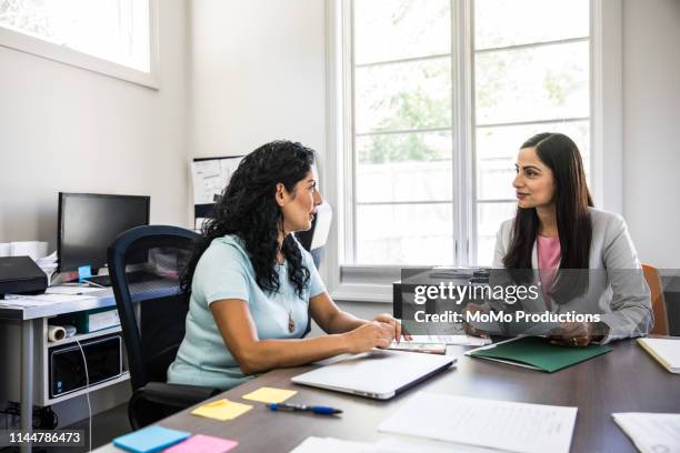 women meeting in business office - face to face interview stock pictures, royalty-free photos & images