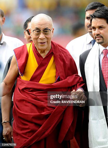 PACKAGETibetan Spiritual Leader The Dalai Lama greets cricket fans as he arrives to watch the IPL match between Deccan Chargers and Kings XI Punjab...