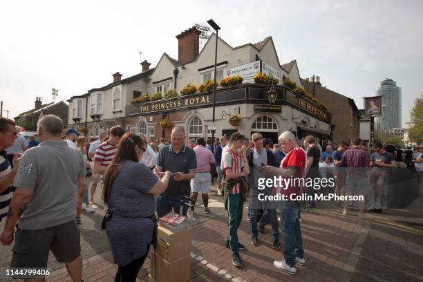 Supporters drinking outside the Princess Royal pub before Brentford hosted Leeds United in an EFL Championship match at Griffin Park. Formed in 1889,...