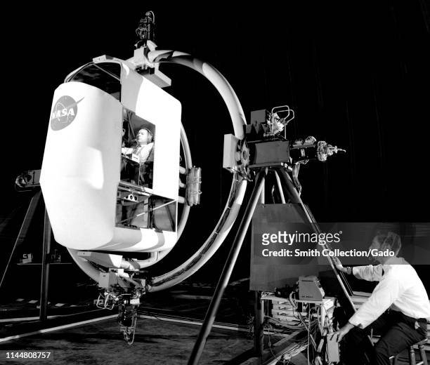 Two NASA engenieers operating the Lunar Rendezvous Simulator at Langley Research Center in Hampton, Virginia, August 17, 1962. Image courtesy...