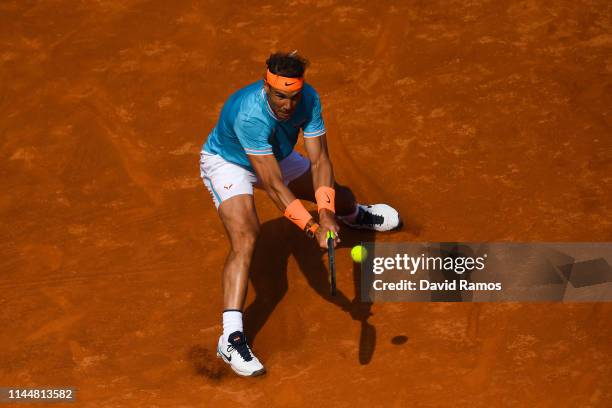 Rafael Nadal of Spain plays a backhand against Leonardo Mayer of the Argentina during the round of 32 match on day two of the Barcelona Open Banc...