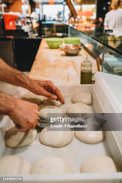 pizza chef preparing the pizza dough at the restaurant - pizza chef stock pictures, royalty-free photos & images