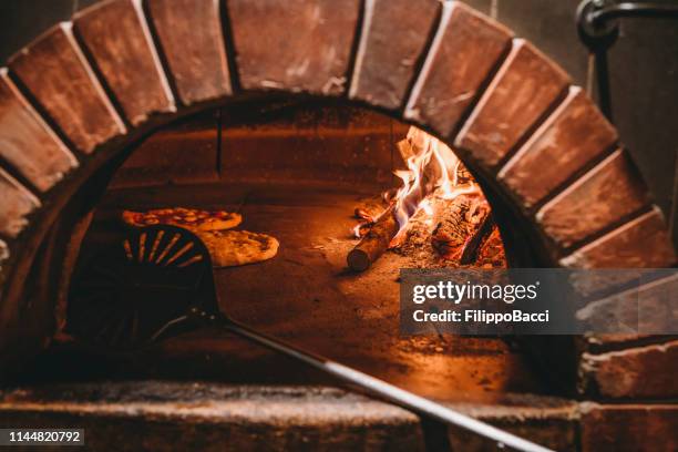 pizza margherita inside the oven - napoli pizza stock pictures, royalty-free photos & images