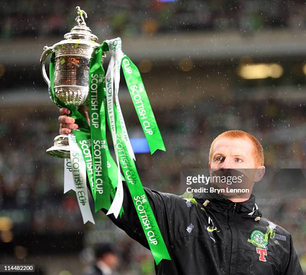 Celtic manager Neil Lennon holds the Scottish Cup aloft after victory in the final between Celtic and Motherwell at Hampden Park on May 21, 2011 in...