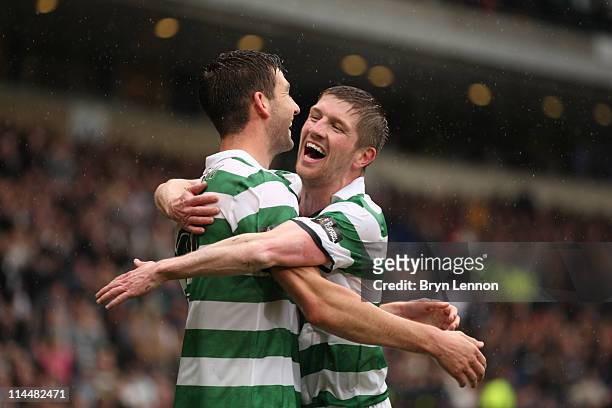 Charlie Mulgrew of Celtic celebrates with Mark Wilson after scoring the third goal in the Scottish Cup final between Celtic and Motherwell, at...