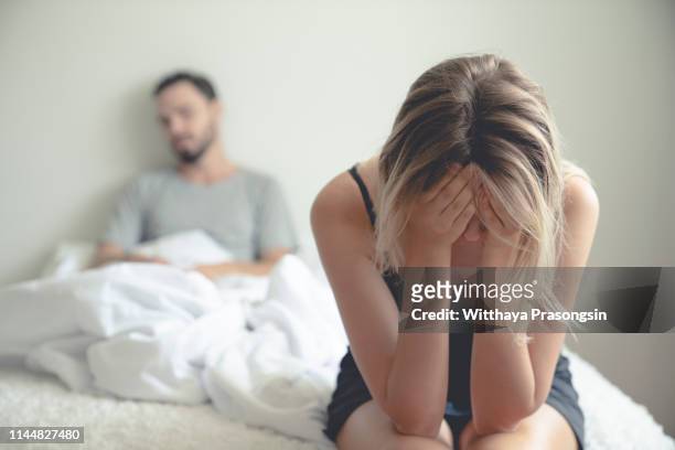frustrated sad girlfriend sit on bed think of relationship problems - fighting stock pictures, royalty-free photos & images
