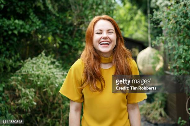 woman laughing, looking at camera - toothy smile stock pictures, royalty-free photos & images