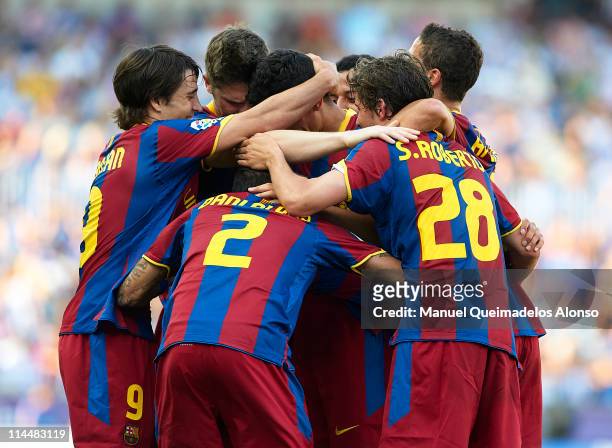 Players of Barcelona celebrate during the La Liga match between Malaga and Barcelona at La Rosaleda Stadium on May 21, 2011 in Malaga, Spain.