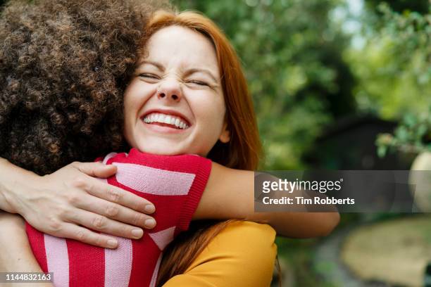 big hug! - affectionate stock pictures, royalty-free photos & images