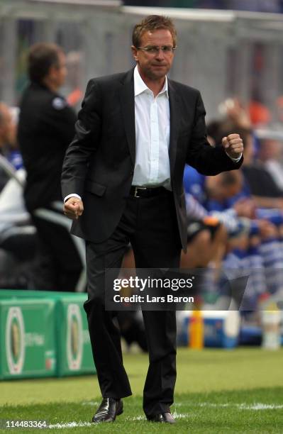 Head coach Ralf Rangnick of Schalke celebrates after Benedikt Hoewedes scored the third goal during the DFB Cup final match between MSV Duisburg and...