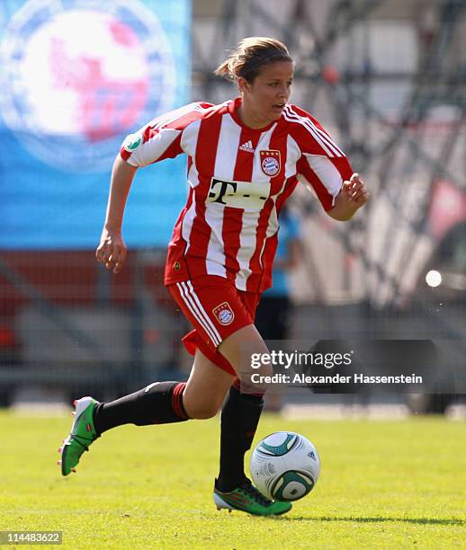 Laura Freisinger of Muenchen runs with the ball during the women Bundesliga Cup 2011 final match between FC Bayern Muenchen and 1.FFC Turbine Potsdam...