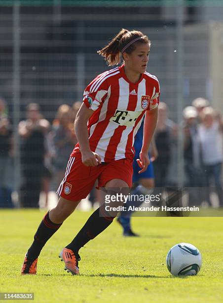 Lena Lotzen of Muenchen runs with the ball during the women Bundesliga Cup 2011 final match between FC Bayern Muenchen and 1.FFC Turbine Potsdam at...