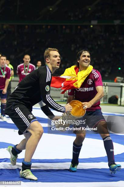 Manuel Neuer and Raúl Gonzalez of Schalke lift the cup afdter winning 5-0 the DFB Cup final match between MSV Duisburg and FC Schalke 04 at Olympic...