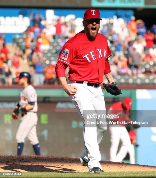 Texas Rangers pitcher Shawn Kelley reacts after striking out the Houston Astros' Robinson Chirinos for the save on April 21 at Globe Life Park in...