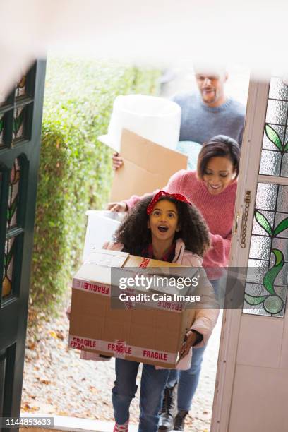 excited family moving into new house - family front door stock pictures, royalty-free photos & images