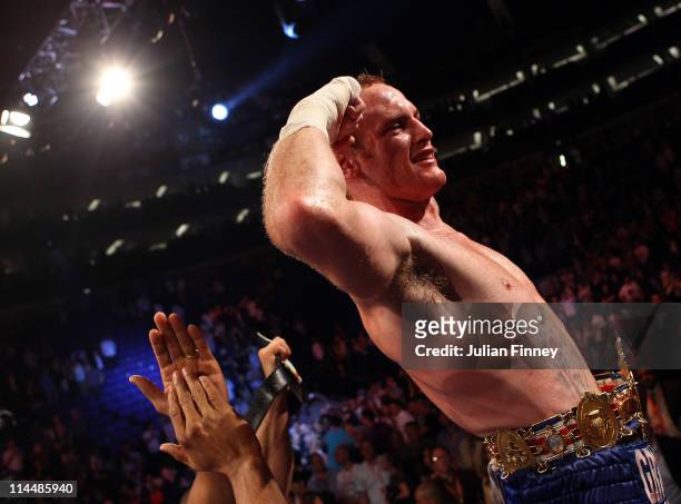 George Groves of England celebrates defeating James DeGale of England in the British and Commonwealth Super-Middleweight Championship during World...