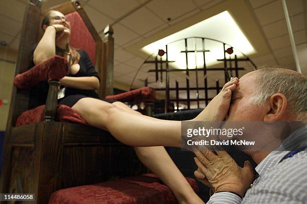 Lola is given a ''foot massage'' during the 8th annual DomCon LA convention on May 20, 2011 in Los Angeles, California. The erotic domination...