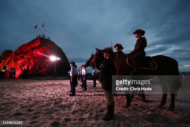 Members of the Mudgeeraba light horse troop take part in the ANZAC dawn service on April 25, 2018 in Currumbin, Australia. Australians commemorating...