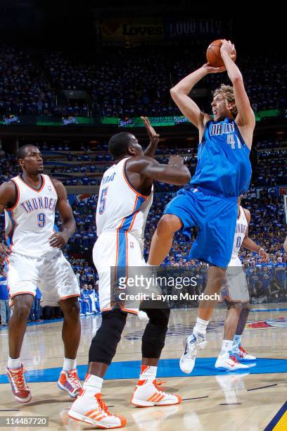 Dirk Nowitzki of the Dallas Mavericks shoots against Kendrick Perkins of the Oklahoma City Thunder during Game Three of the Western Conference Finals...