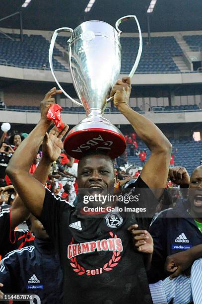 Orlando Pirates captain Lucky Lekgwathi holds aloft the premiership trophy after winning the Absa Premiership Final match between Orlando Pirates and...