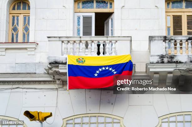 santa clara, cuba: venezuela flag in a balcony - venezuela flag stock pictures, royalty-free photos & images